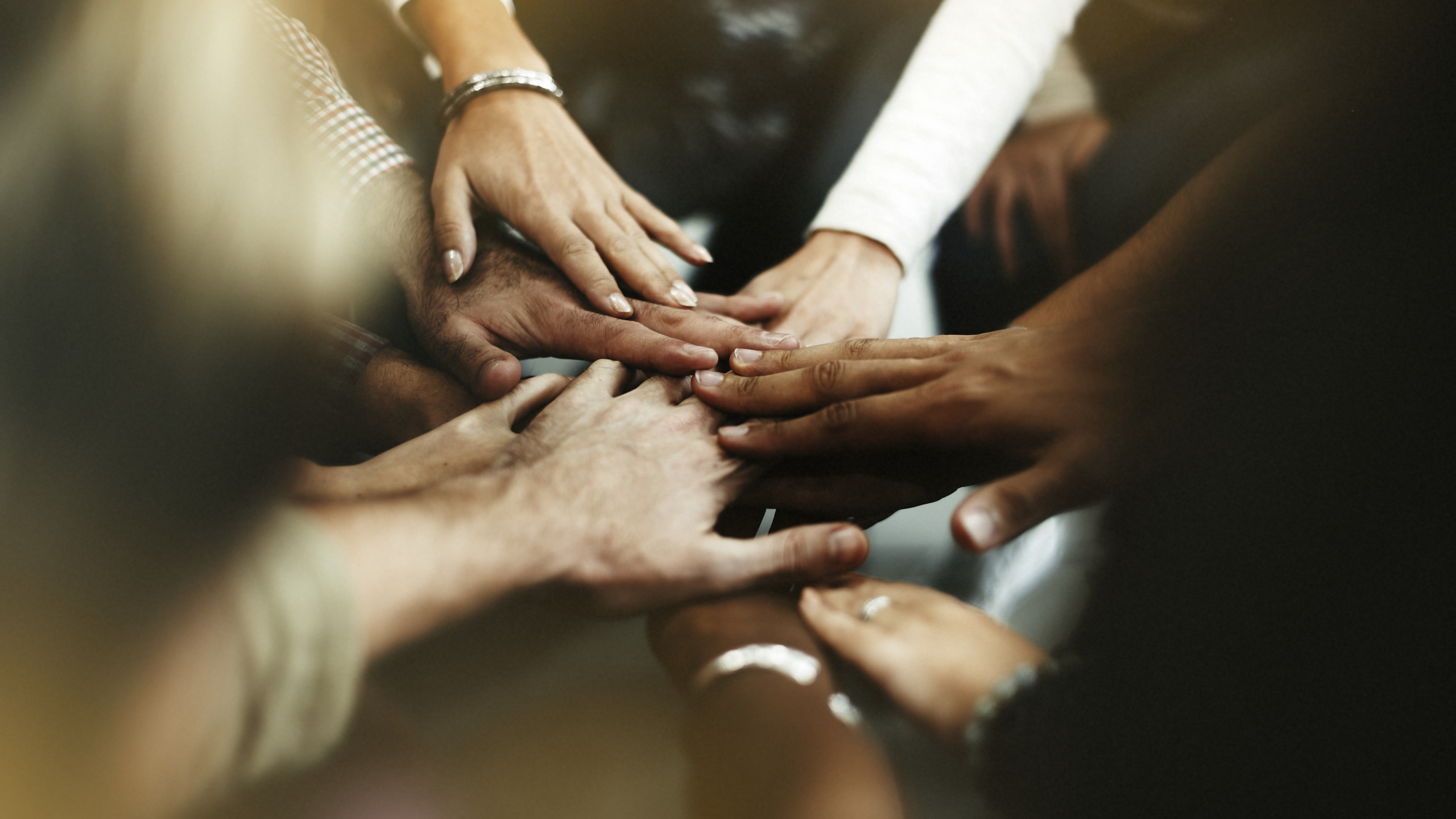 Diverse people joining their hands together - ACHFN, African & Caribbean Heritage Food Network