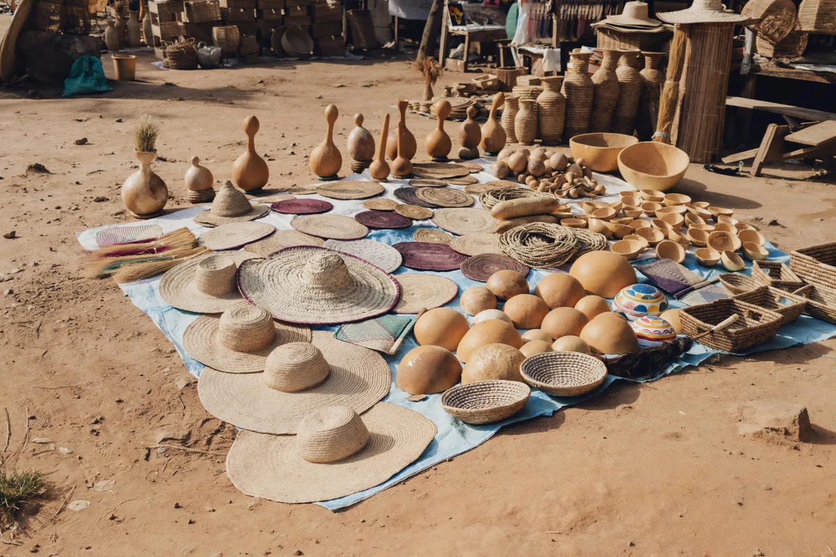African and Caribbean Heritage Food Network craft market display with woven hats, bowls, and hand-shaped vessels representing cultural heritage